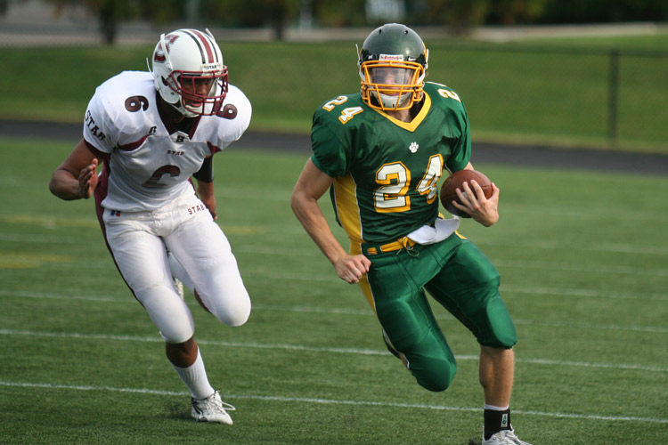 Collegiate School senior, Teddy Gorrell (right) breaks away and gains some yardage during Friday afternoon�s game against St. Anne�s Belfield.  � Mike Lynaugh
