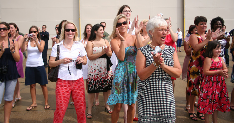 Family members of naval aviators from VFA-103 "Jolly Rogers" wait for their return home to NAS Oceana from a 5 month deployment overseas aboard USS Dwight D. Eisenhower (CVN 69).  � Mike Lynaugh