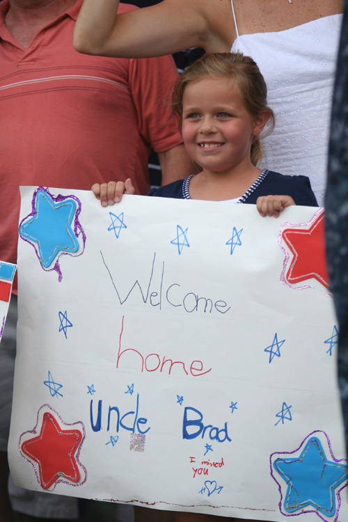 Kelsi Davis welcomes back her uncle, Lt. Commander Brad Gilroy from VFA-83 "Rampagers" at NAS Oceana after he completed a 5 month deployment overseas aboard USS Dwight D. Eisenhower (CVN 69).�  � Mike Lynaugh
