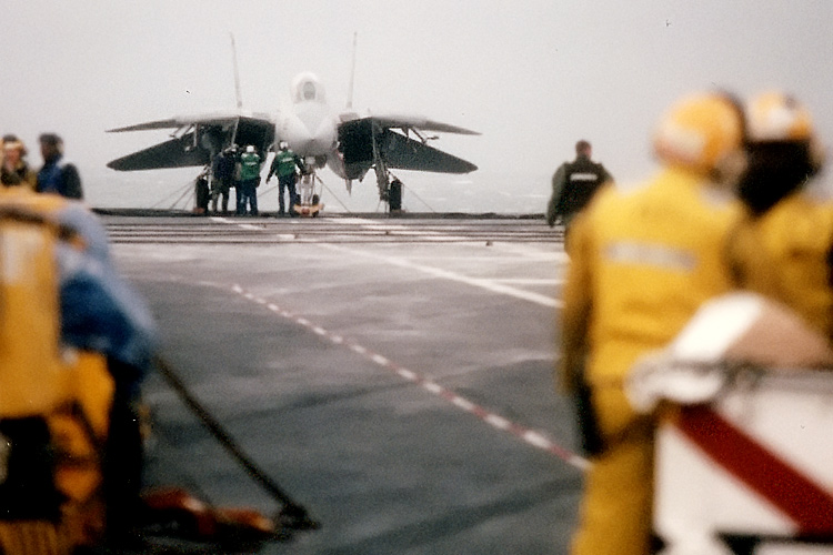 An F-14 Tomcat from VF-32 "The Swordsmen" on the flight deck of the U.S.S. Enterprise.  � Mike Lynaugh