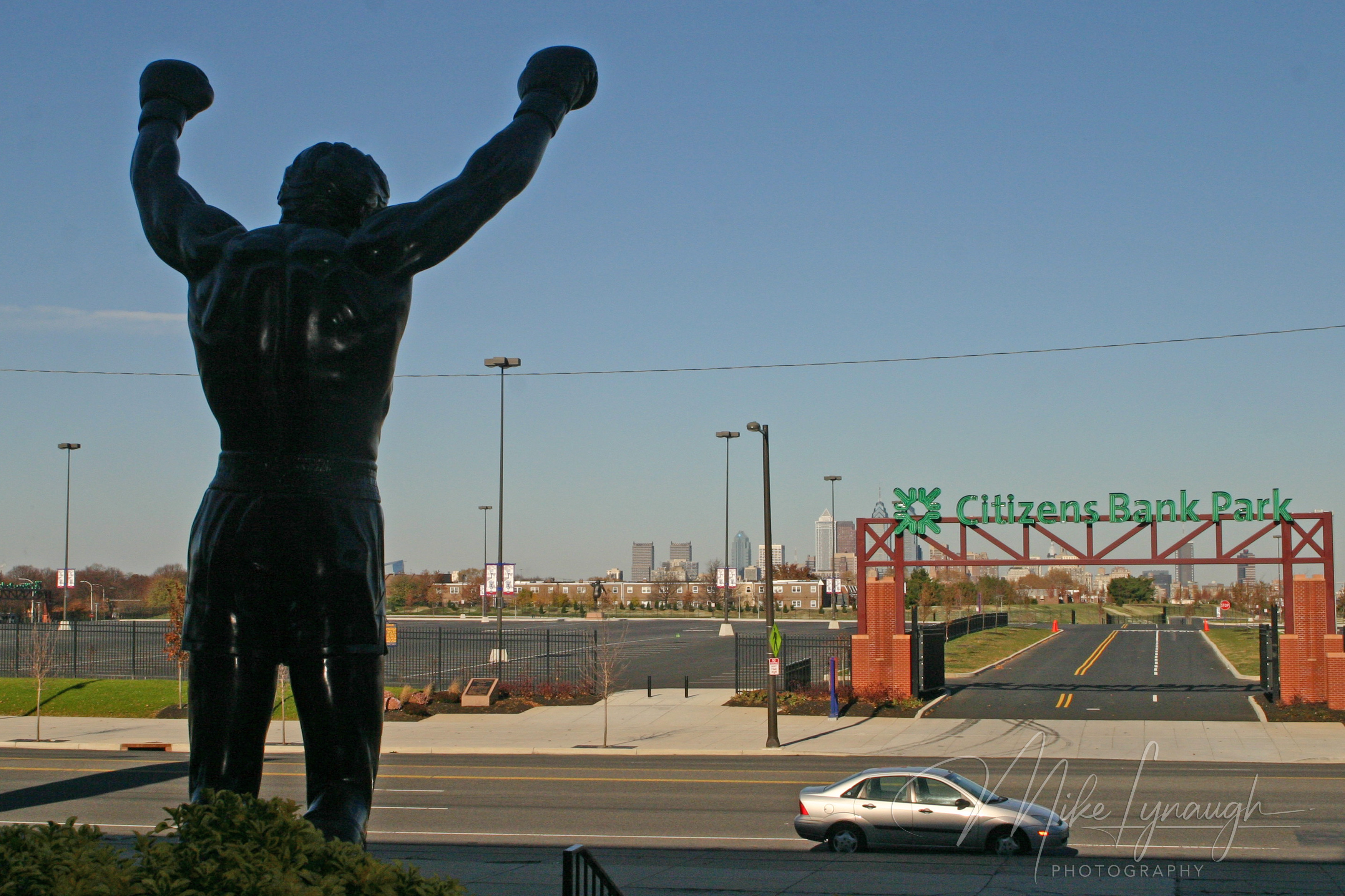 The Rocky statue photographed from in front of the Philadelphia Spectrum arena as seen from behind.