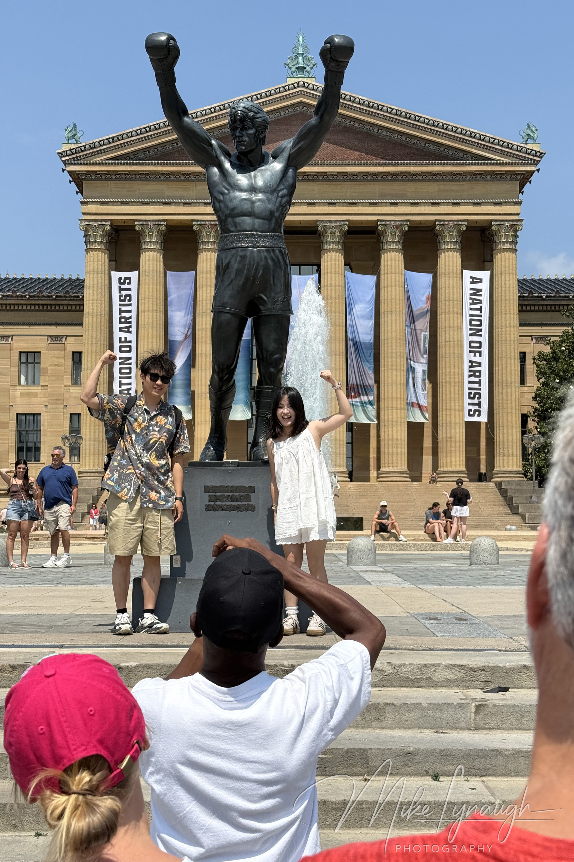 Rocky Statue — Posing with Rocky. Visitors strike the iconic Rocky pose at the Rocky statue.