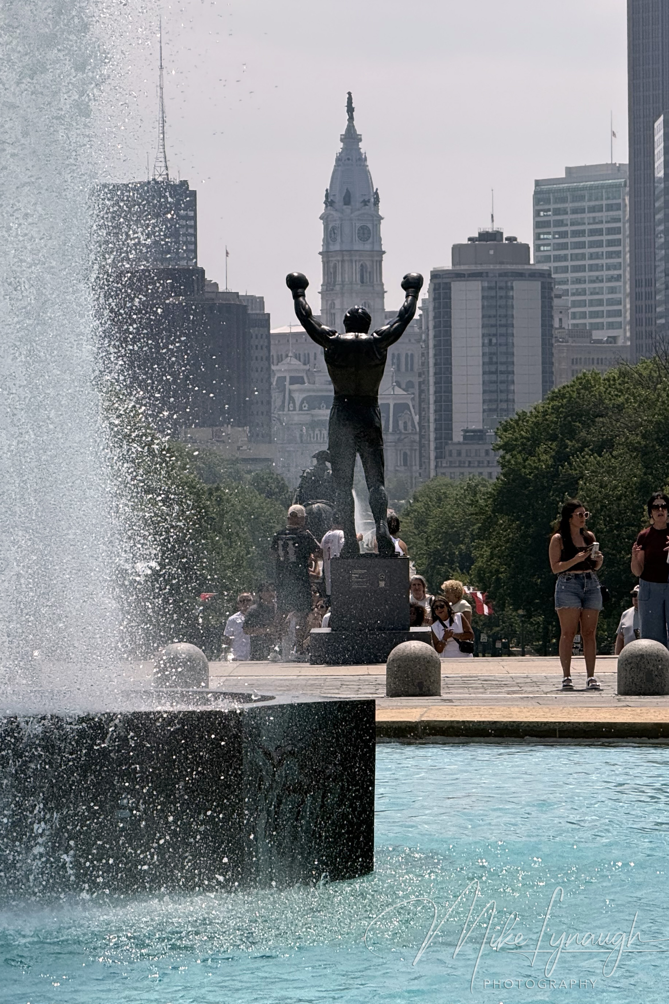 Visitors pose with the Rocky Statue at the Philadelphia Museum of Art.
