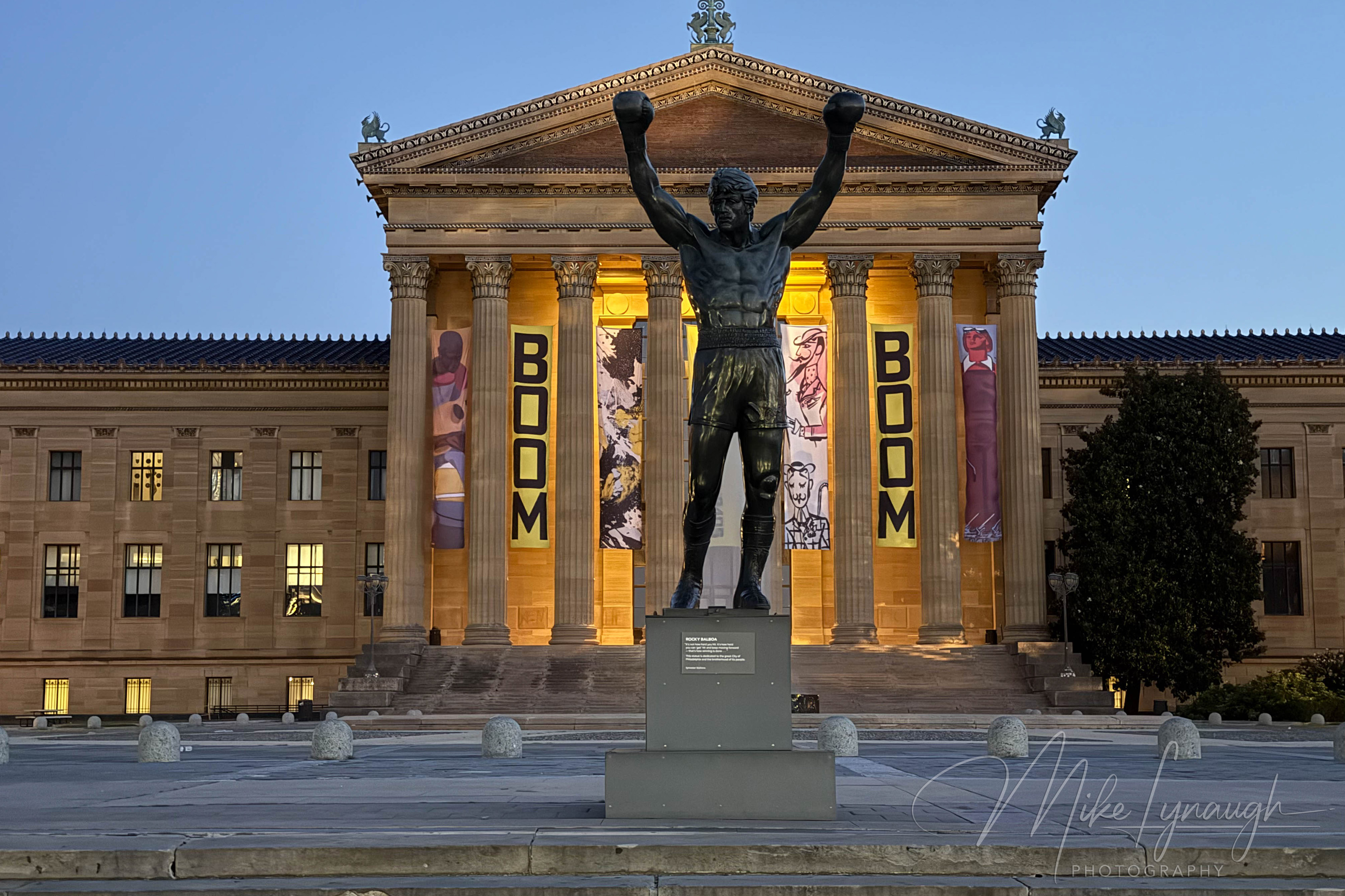 The Rocky Statue standing proudly at the top of the iconic Rocky Steps.