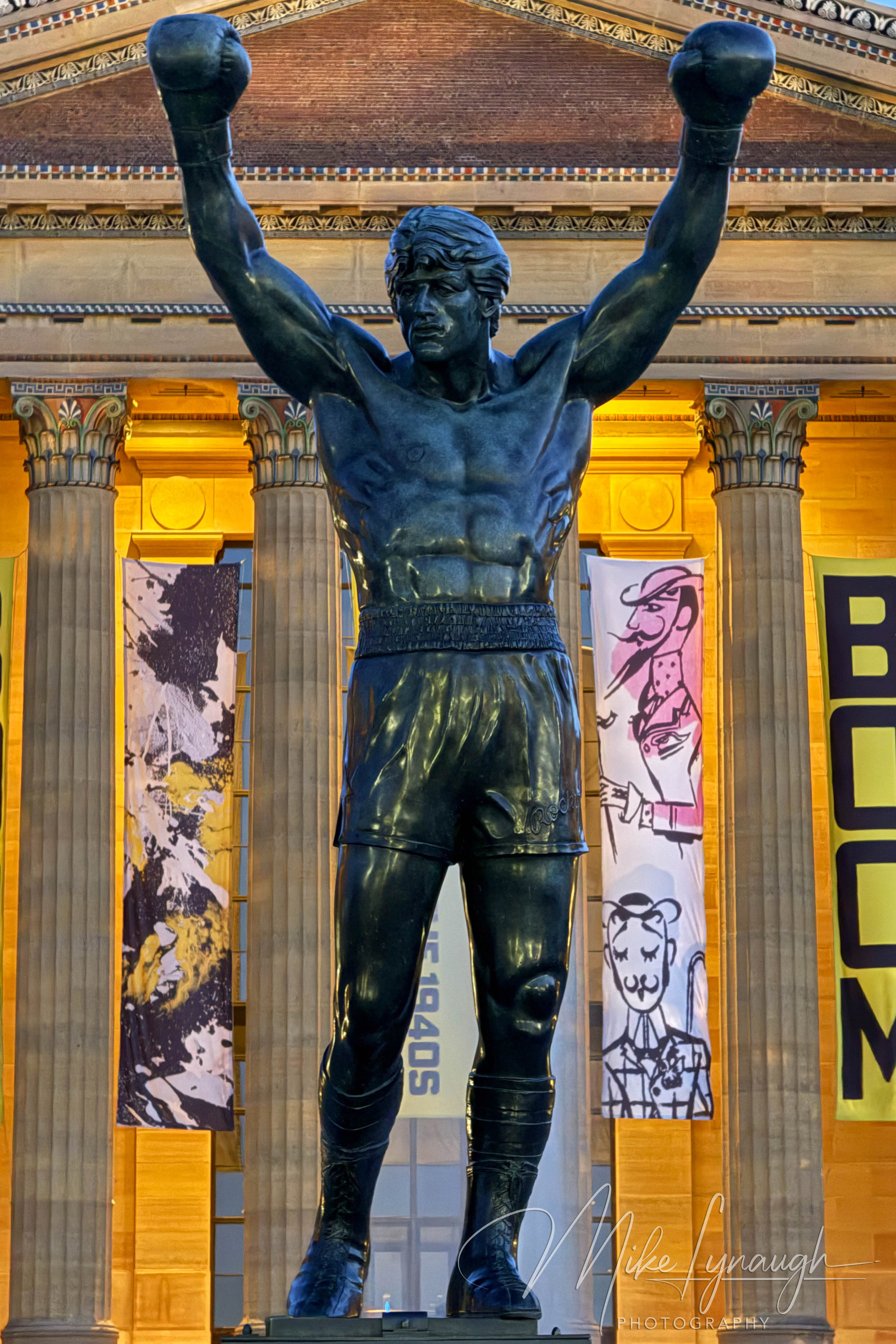 Rocky Statue — At the top of the Rocky Steps. The Rocky statue framed by the pillars of the Philadephia Museum of Art.