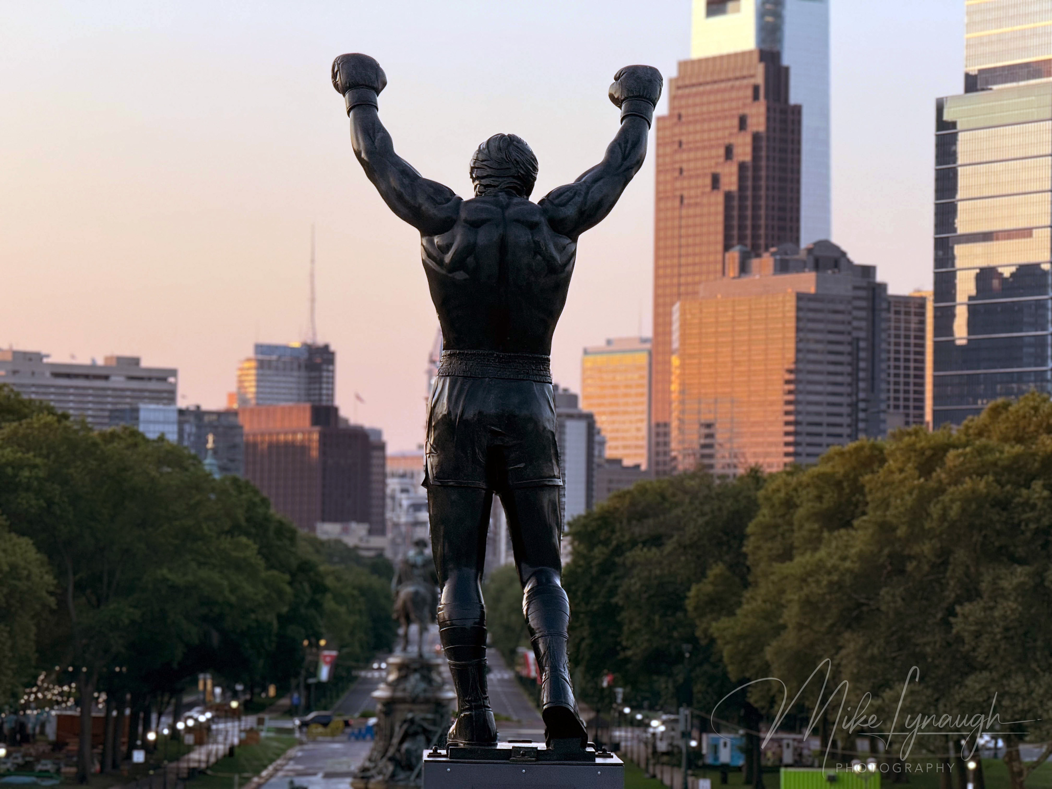 Rocky Statue — Overlooking the Philadelphia Skyline at sunrise. Sylvester Stallone's personal Rocky Statue overlooks the Philadelphia skyline as the morning light begins to illuminate the city.
