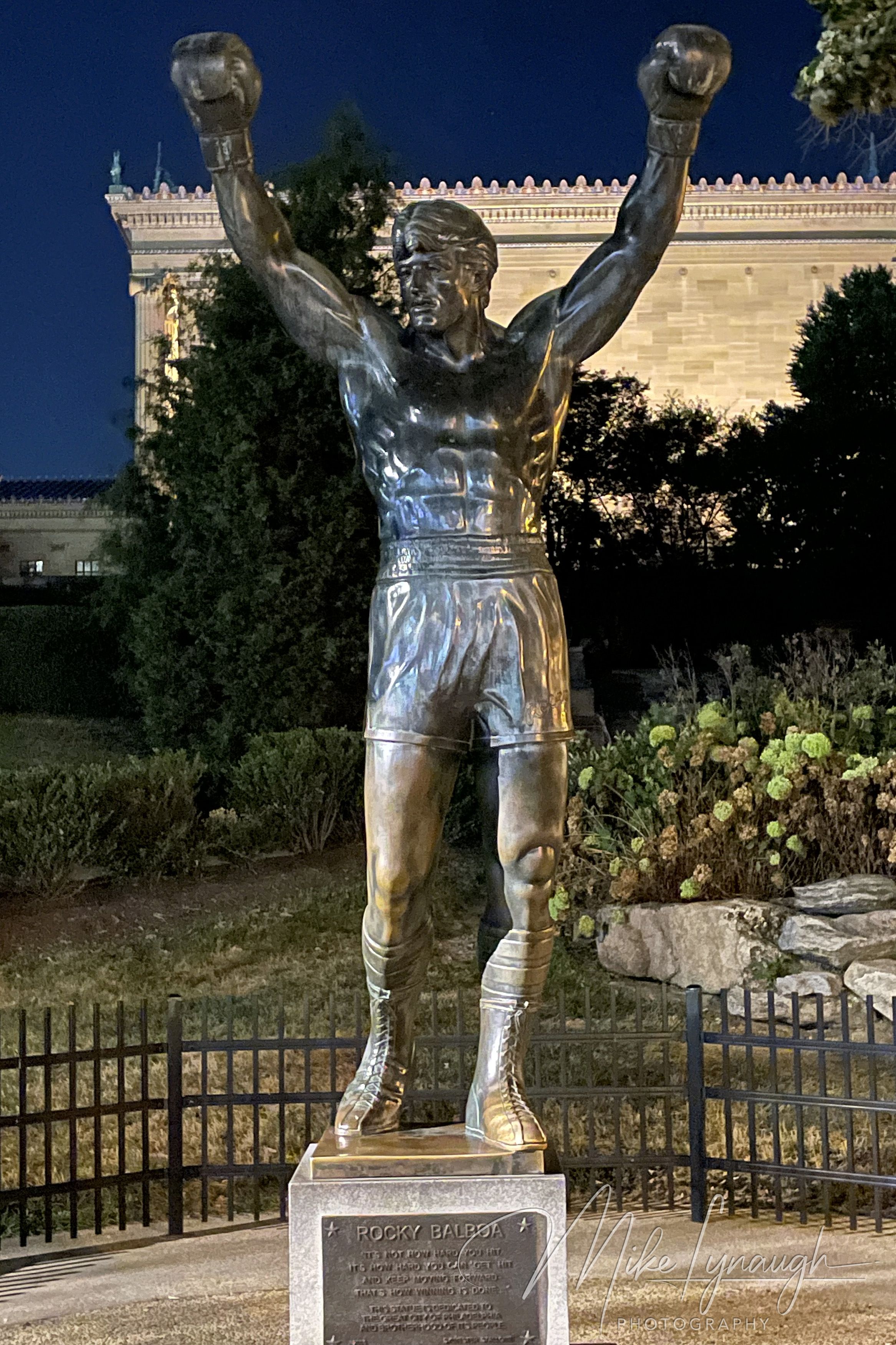 The original Rocky Statue that was featured in the movie Rocky III stands proudly at night at the base of the iconic Rocky Steps.