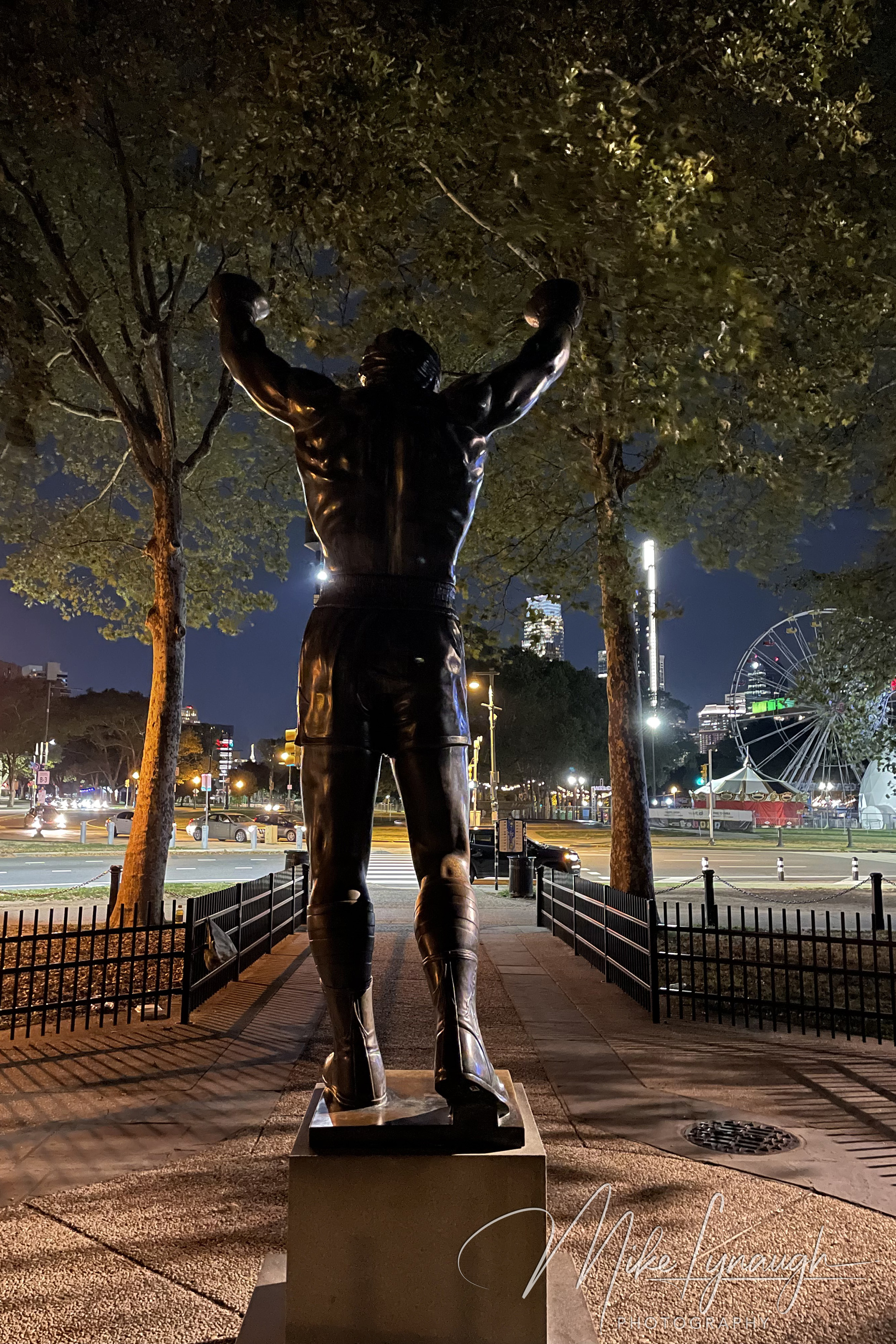 The original Rocky Statue that was featured in the movie Rocky III stands proudly at night at the base of the iconic Rocky Steps.