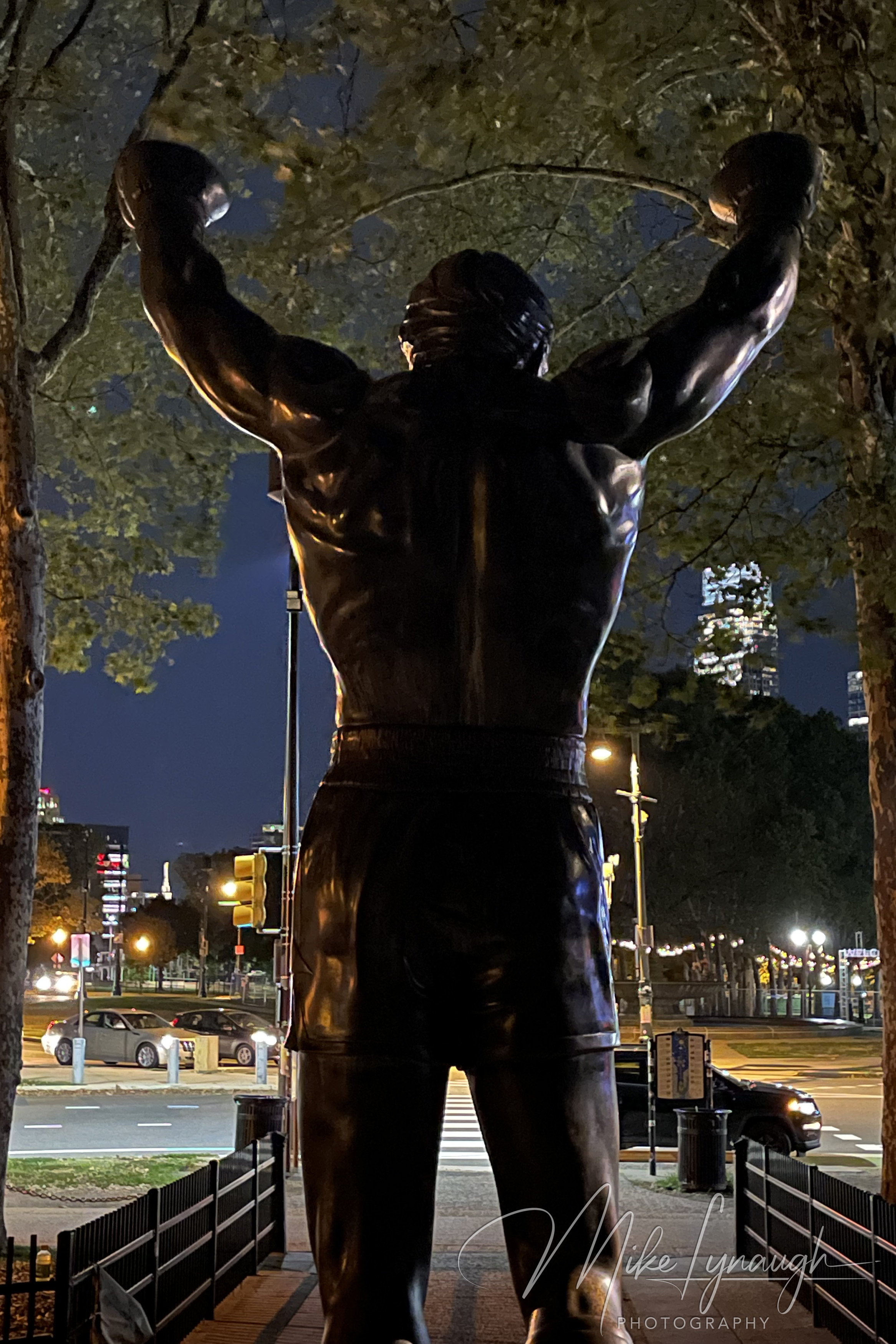 The original Rocky Statue that was featured in the movie Rocky III stands proudly at night at the base of the iconic Rocky Steps.