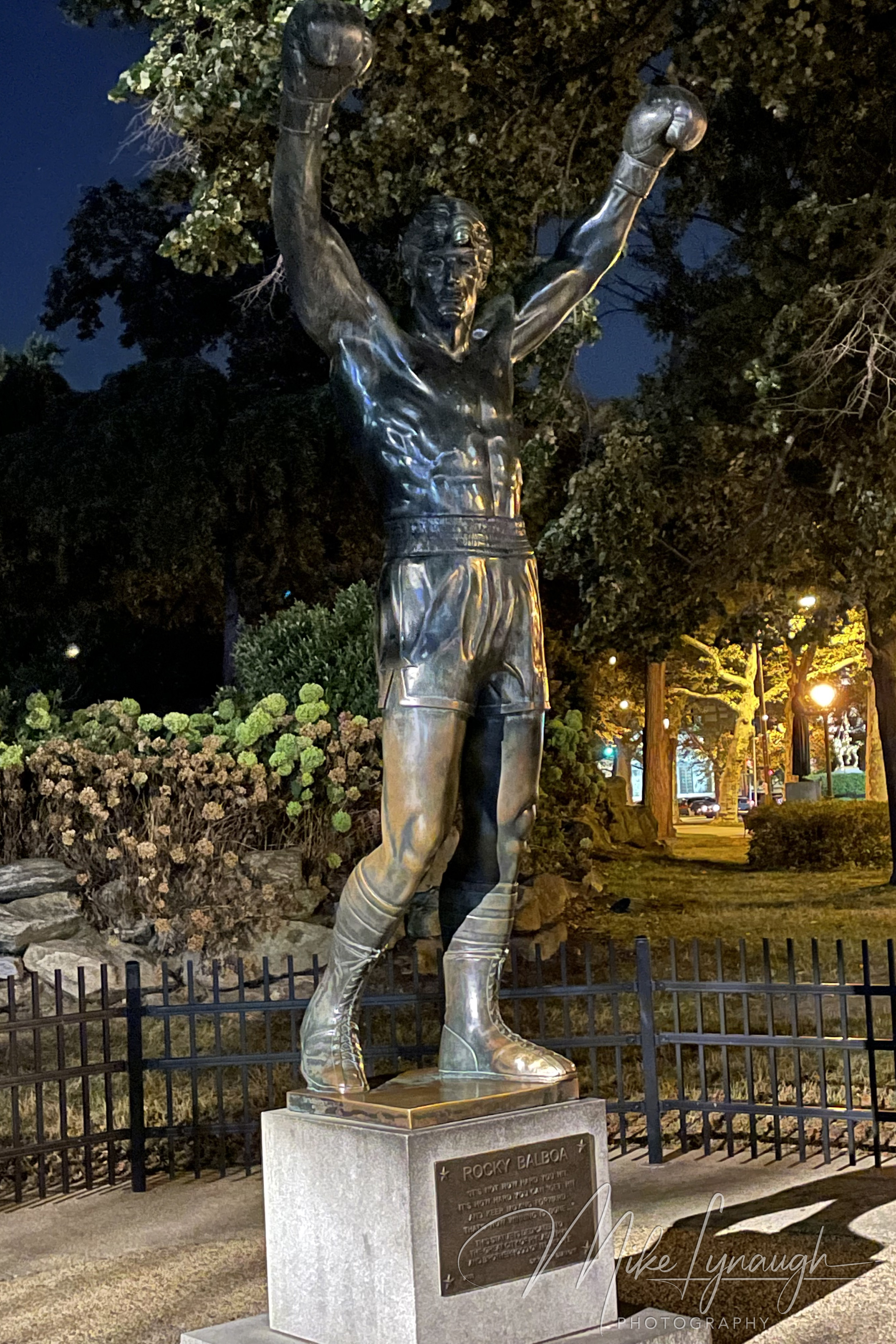 The original Rocky Statue that was featured in the movie Rocky III stands proudly at night at the base of the iconic Rocky Steps.