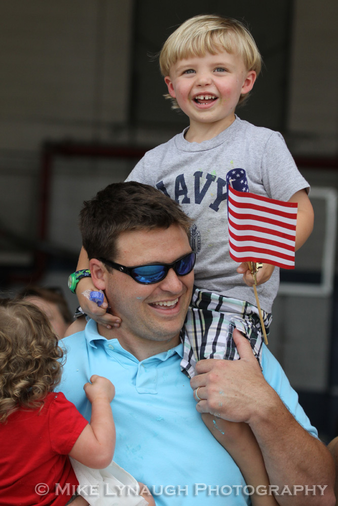 Family members and friends of the Aviators of VFA-83 "Rampagers" await their loved one's return home to Naval Air Station Oceana following a 7 month deployment in the Gulf on the USS Eisenhower on July 27, 2010.  � Mike Lynaugh