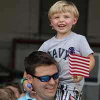Family members and friends of the Aviators of VFA-83 "Rampagers" await their loved one's return home to Naval Air Station Oceana following a 6 month deployment in the Gulf on the USS Eisenhower on July 27, 2010.  � Mike Lynaugh
