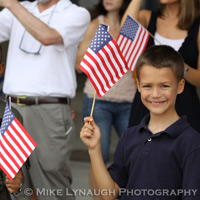 Family members and friends of the Aviators of VFA-83 "Rampagers" await their loved one's return home to Naval Air Station Oceana following a 6 month deployment in the Gulf on the USS Eisenhower on July 27, 2010.  � Mike Lynaugh