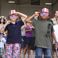 Family members and friends of the Aviators of VFA-83 "Rampagers" await their loved one's return home to Naval Air Station Oceana following a 6 month deployment in the Gulf on the USS Eisenhower on July 27, 2010.  � Mike Lynaugh