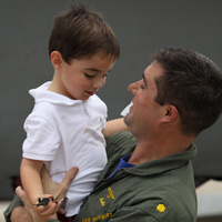 Aviators from VFA-83 "Rampagers" return home to Naval Air Station Oceana following a 6 month deployment in the Gulf on the USS Eisenhower on July 27, 2010.  � Mike Lynaugh