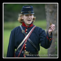 ivil War reenactor Bethany Lacy explains the process of firing a cannon during an artillery demonstration at Manassas National Battlefield Park during the 143rd anniversary of the Battle of First Manassas, the first major battle of the Civil War. Bethany Lacy is one of only a handful of female artillery living historians. Although there were approximately 600 documented cases in which women fought in combat roles during battles during the Civil War, the "vivandi�res", there is still a prejudice among some today that it is not appropriate for a female to portray Civil War combatants.  � Mike Lynaugh Photography
