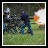 Civil War reenactors Bethany Lacy (left) and Paul Gross (right) fire a 10-pound Parrott rifle gun during an artillery demonstration at Manassas National Battlefield Park during the 143rd anniversary of the Battle of First Manassas, the first major battle of the Civil War. Bethany Lacy is one of only a handful of female artillery living historians. Although there were approximately 600 documented cases in which women fought in combat roles during battles during the Civil War, the "vivandi�res", there is still a prejudice among some today that it is not appropriate for a female to portray Civil War combatants.  � Mike Lynaugh Photography